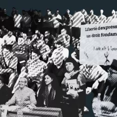 A gathering of people with banners, advocating for freedom of expression.