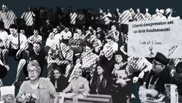 A gathering of people with banners, advocating for freedom of expression.