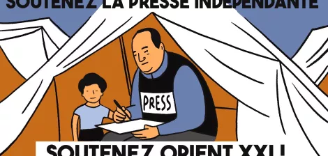 Un uomo scrive con una ragazza vicino, in una tenda, promuovendo la stampa indipendente.